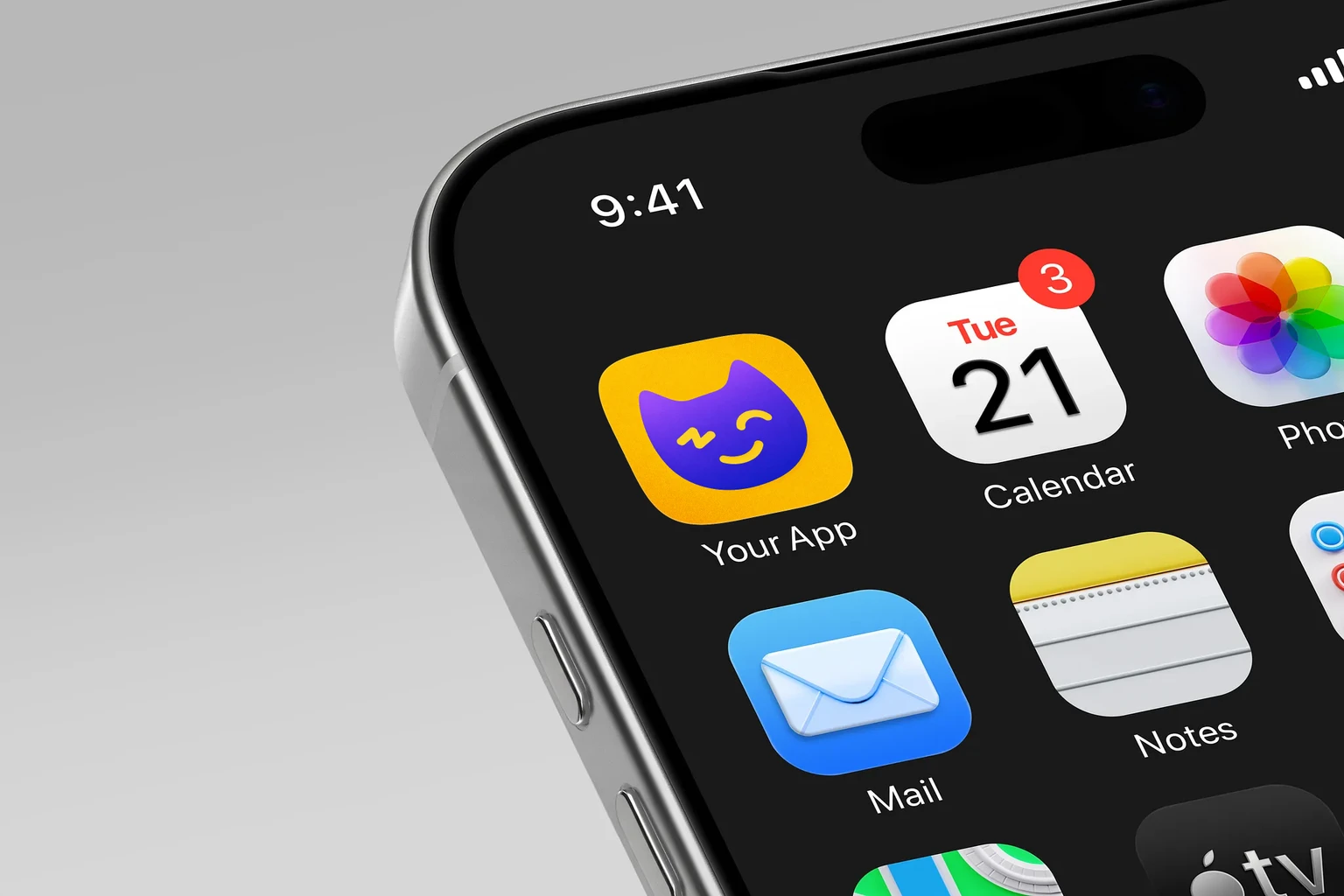 Rounded purple cat face with a winking eye and yellow smile on a textured golden-yellow background shown on an iPhone home screen